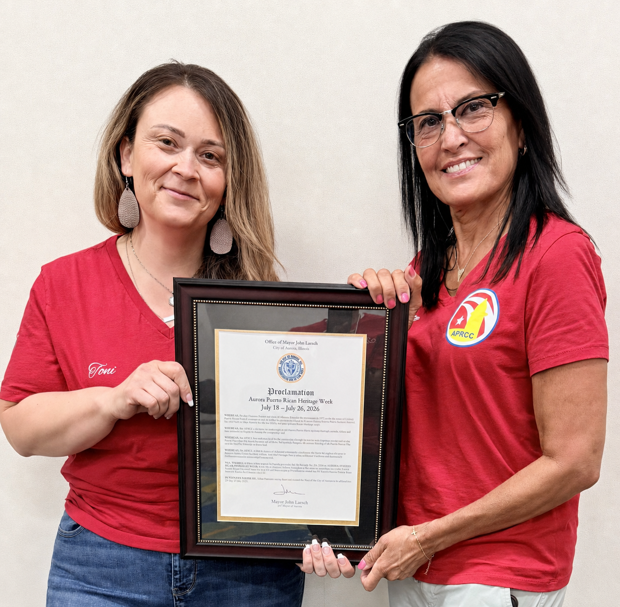 Toni and Evette accepting Aurora's Puerto Rican Heritage Week proclamation on July 21, 2026.