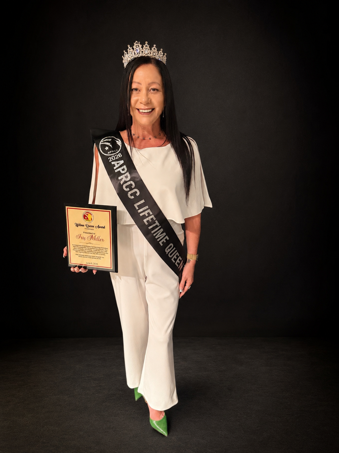 Iris Miller receives the Lifetime Queen Award at the 2026 APRCC Educational Award Pageant.