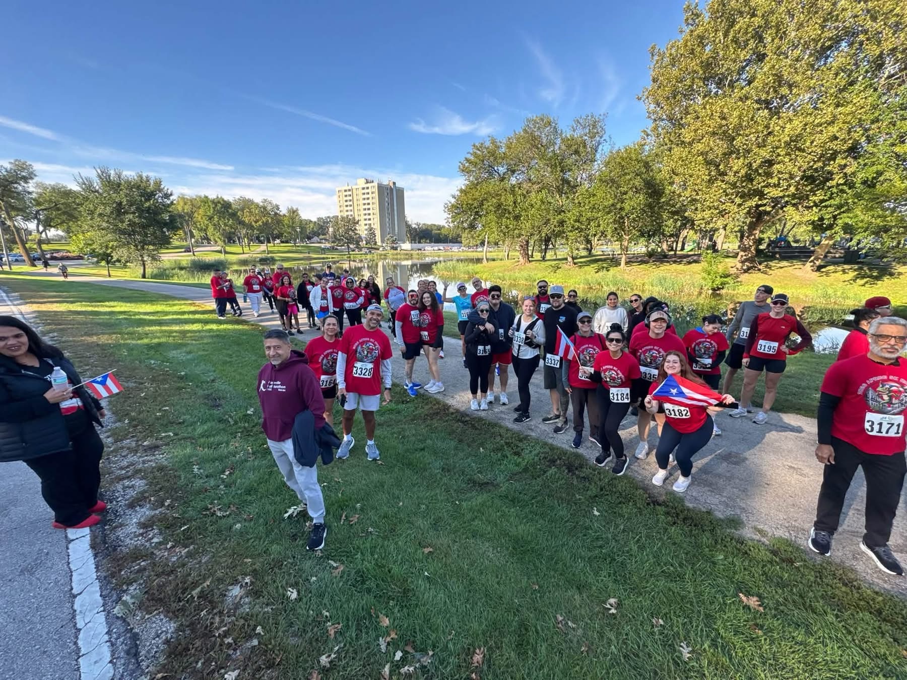 Runners and walkers gathering at the 2026 Coquí 5K in Phillips Park