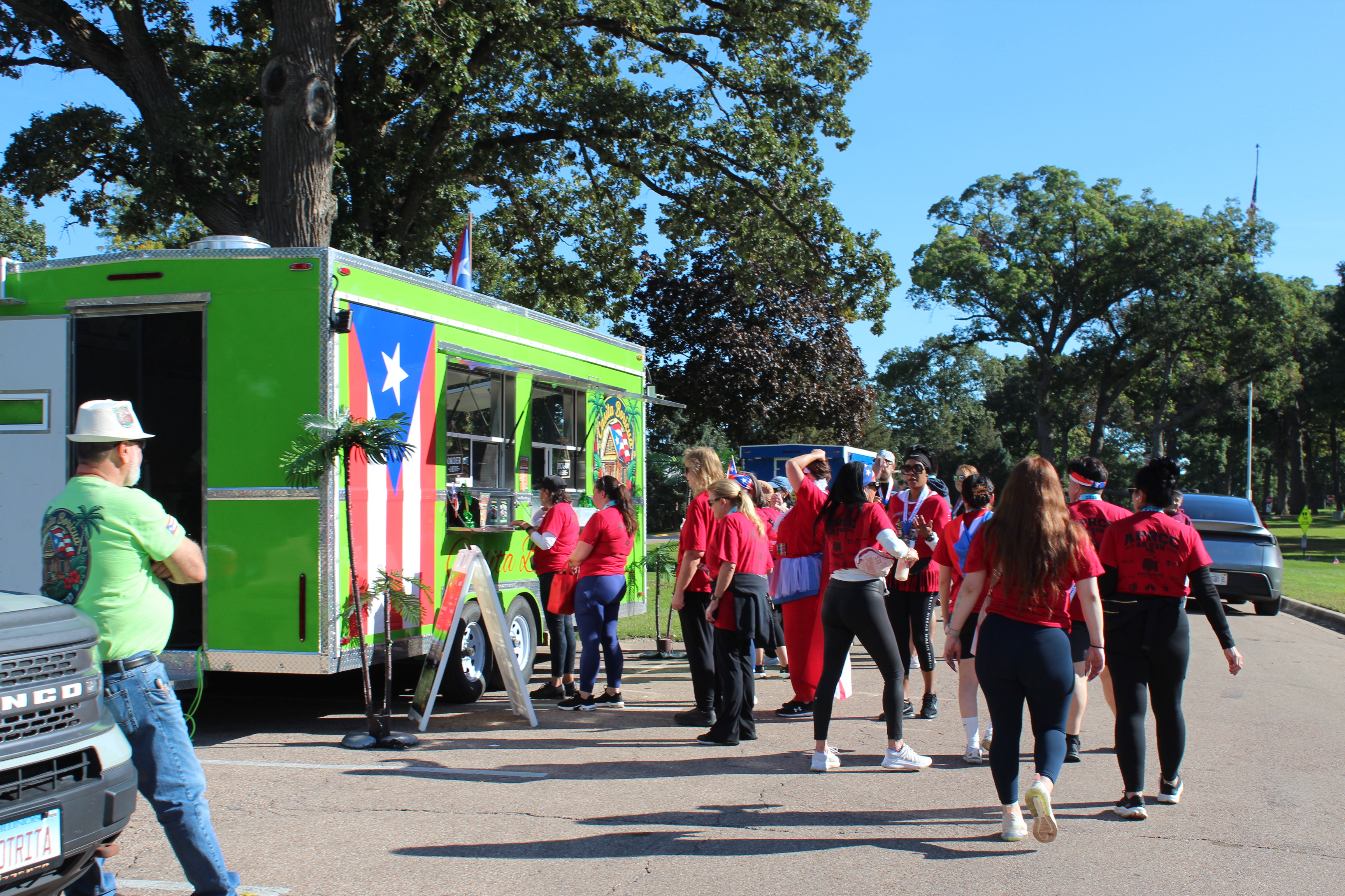 Participants visiting the Casita Boricua food truck after the race