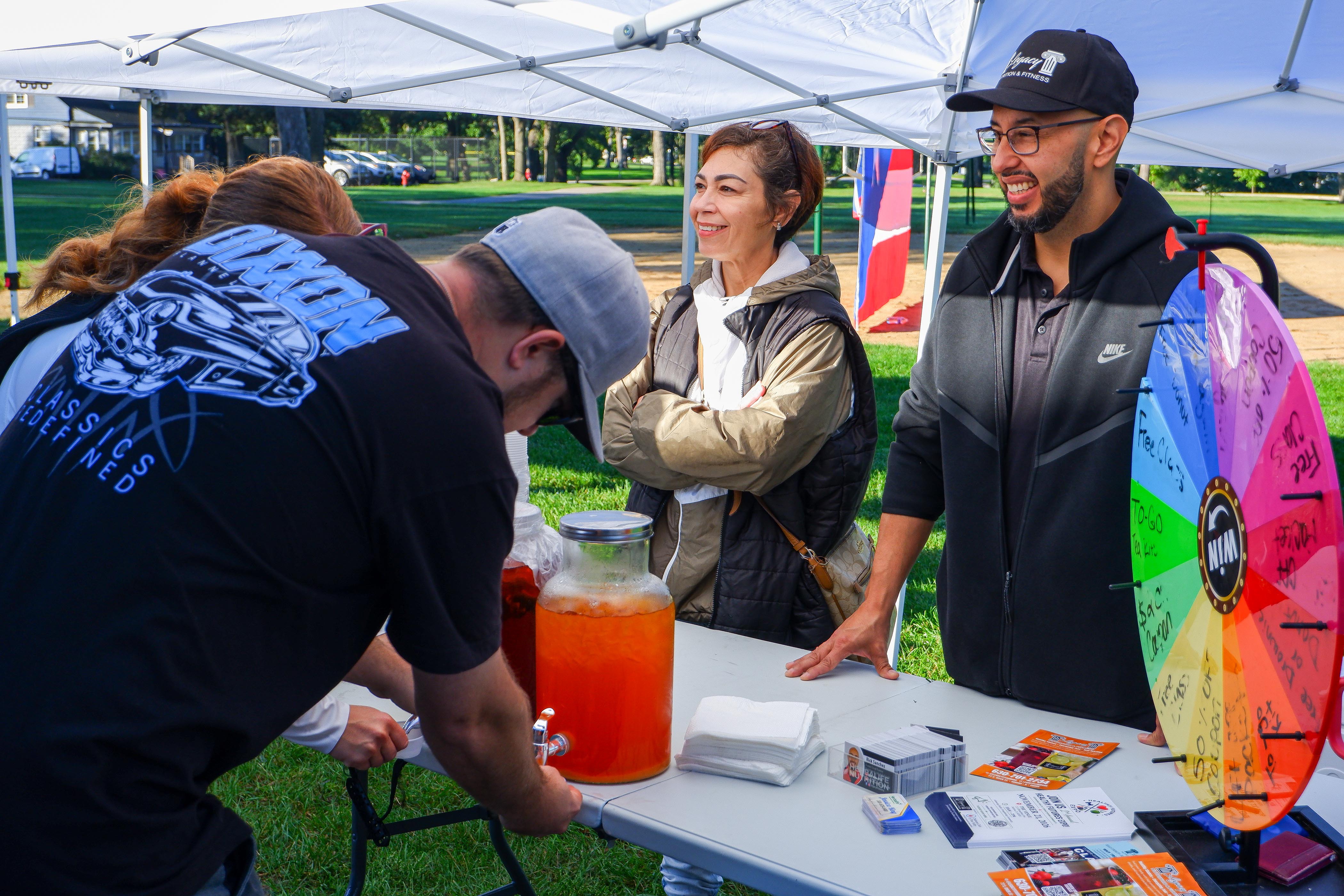 Guests visiting the Legacy Nutrition and Fitness booth