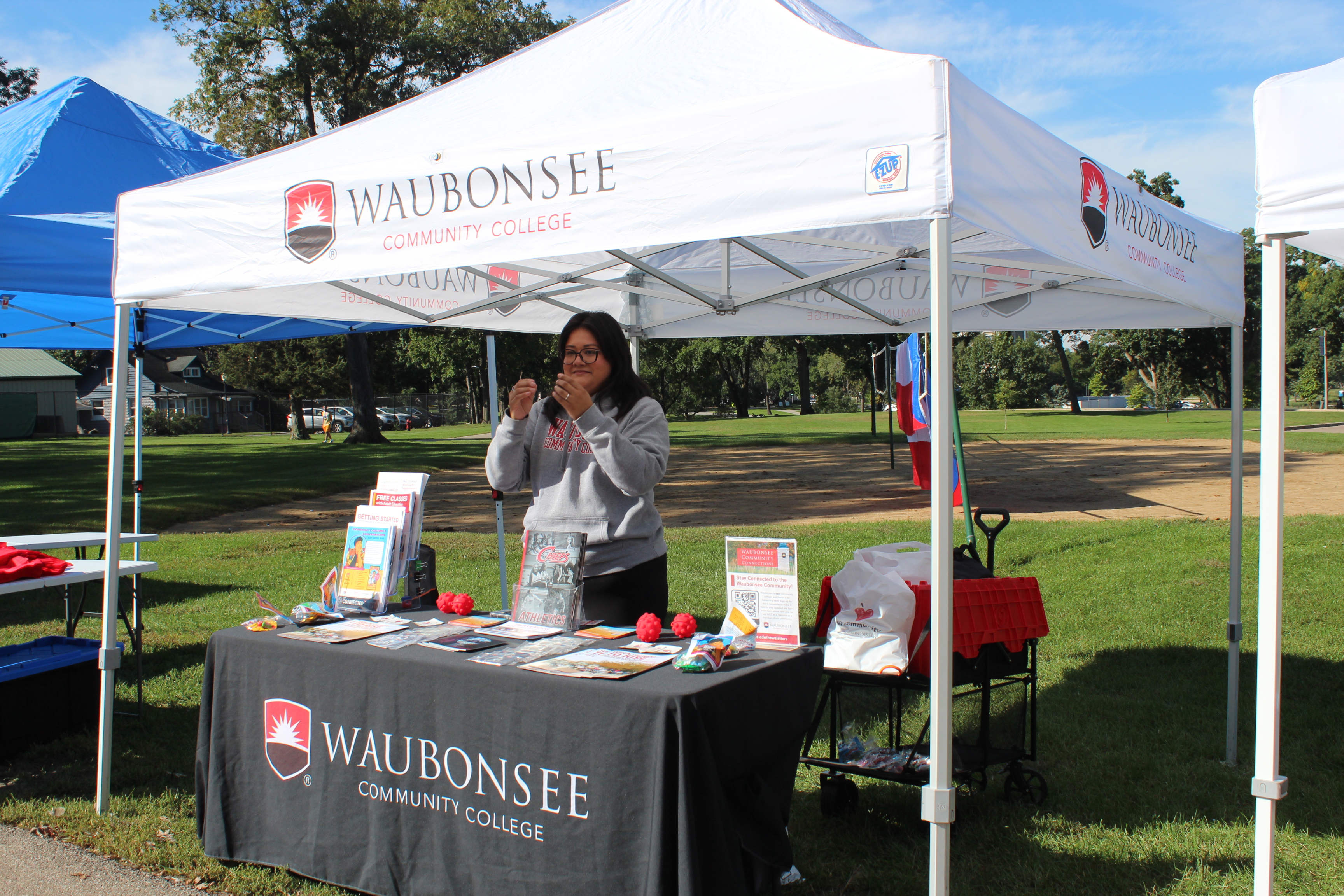 The Waubonsee Community College community table at the Coquí 5K